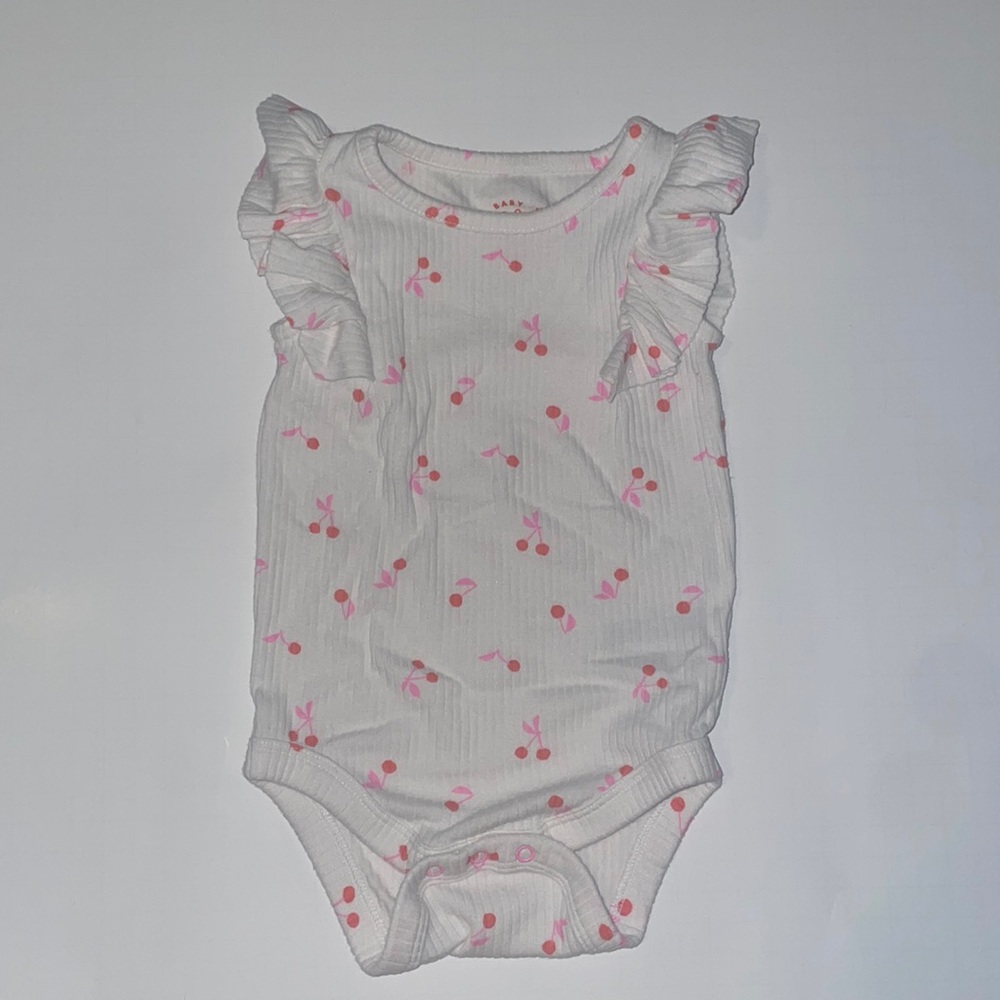 Cat & Jack onesie with cherry pattern.